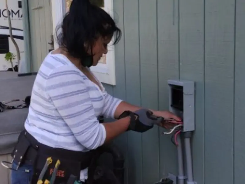 Licensed electrician wiring an exterior subpanel in Pocahontas